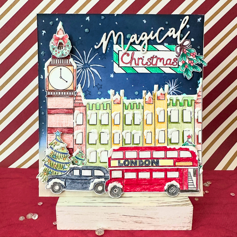 handmade Magical Christmas in London card with Big Ben, black cab and London bus on a night sky background