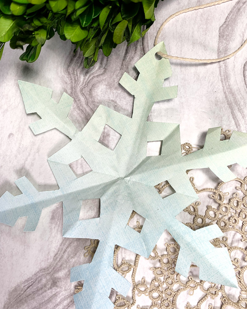 handmade paper snowflake decoration made from patterned paper