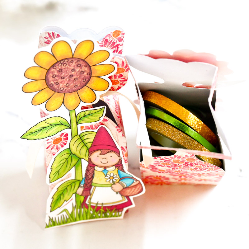 colourful gift box containing washi tape with a hand drawn sunflower and garden gnome on the front