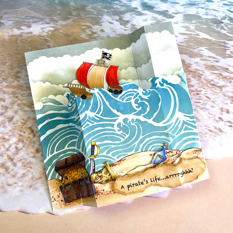 hand made pirate ship card with sea and buried treasure set on a beach background