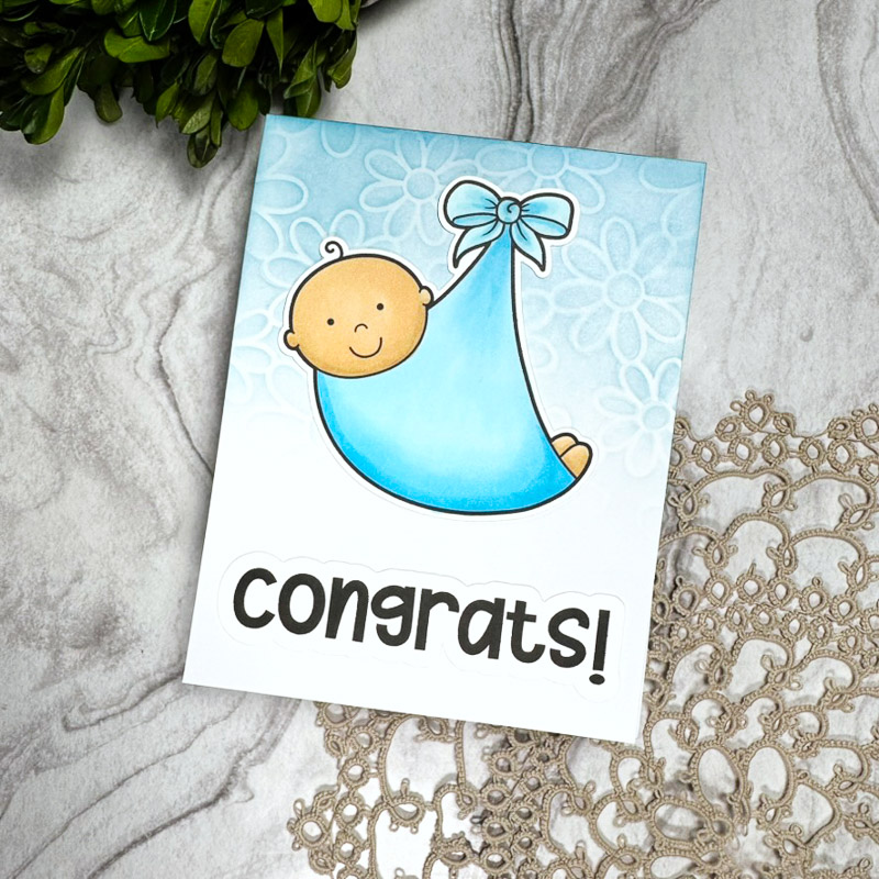 hand made new baby card with patterned background