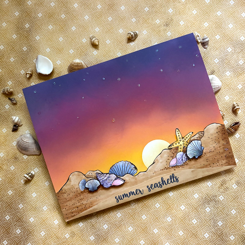 hand made beach sunset card with coloured shells